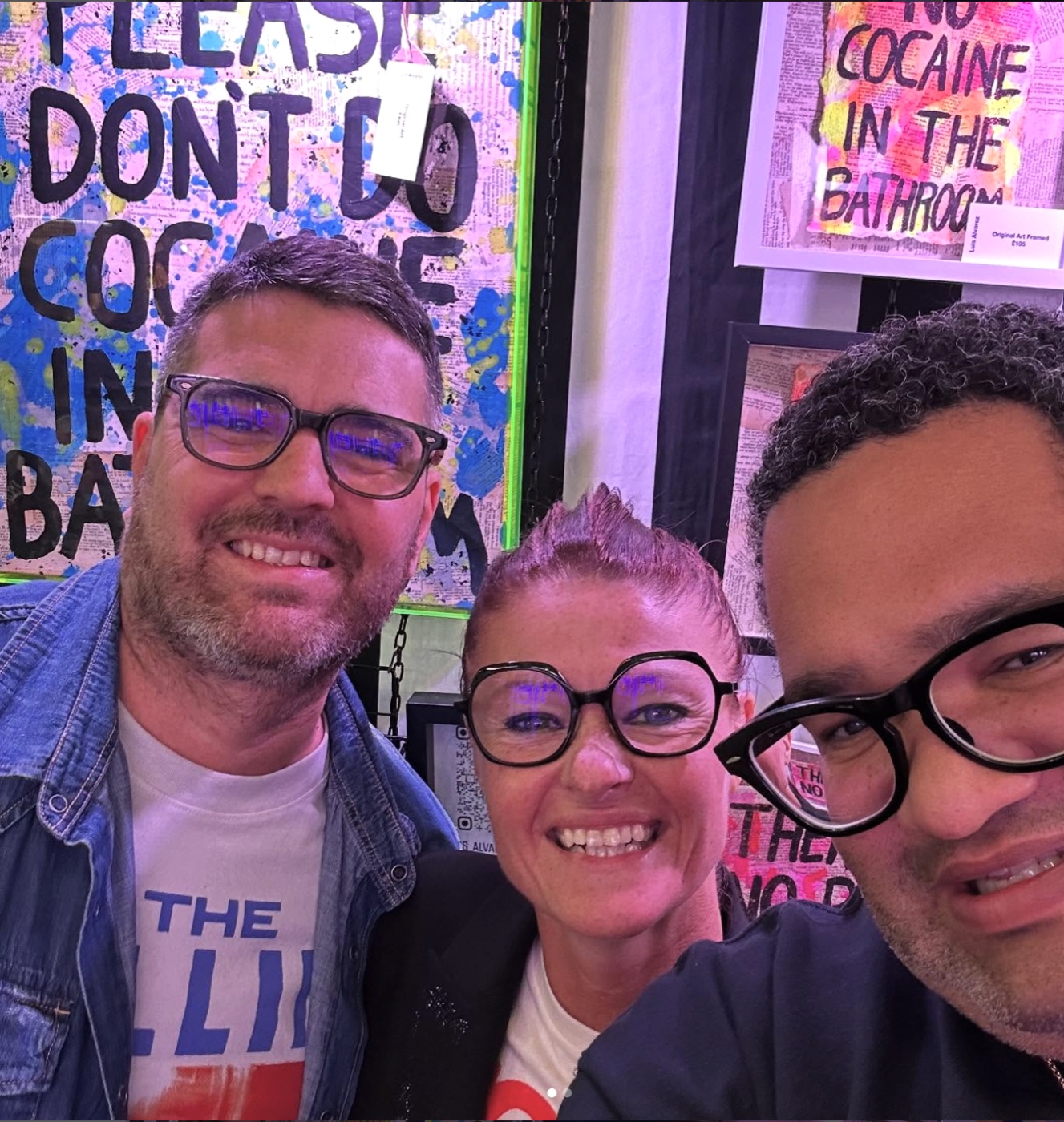 Luis Alvarez with collectors at his stall